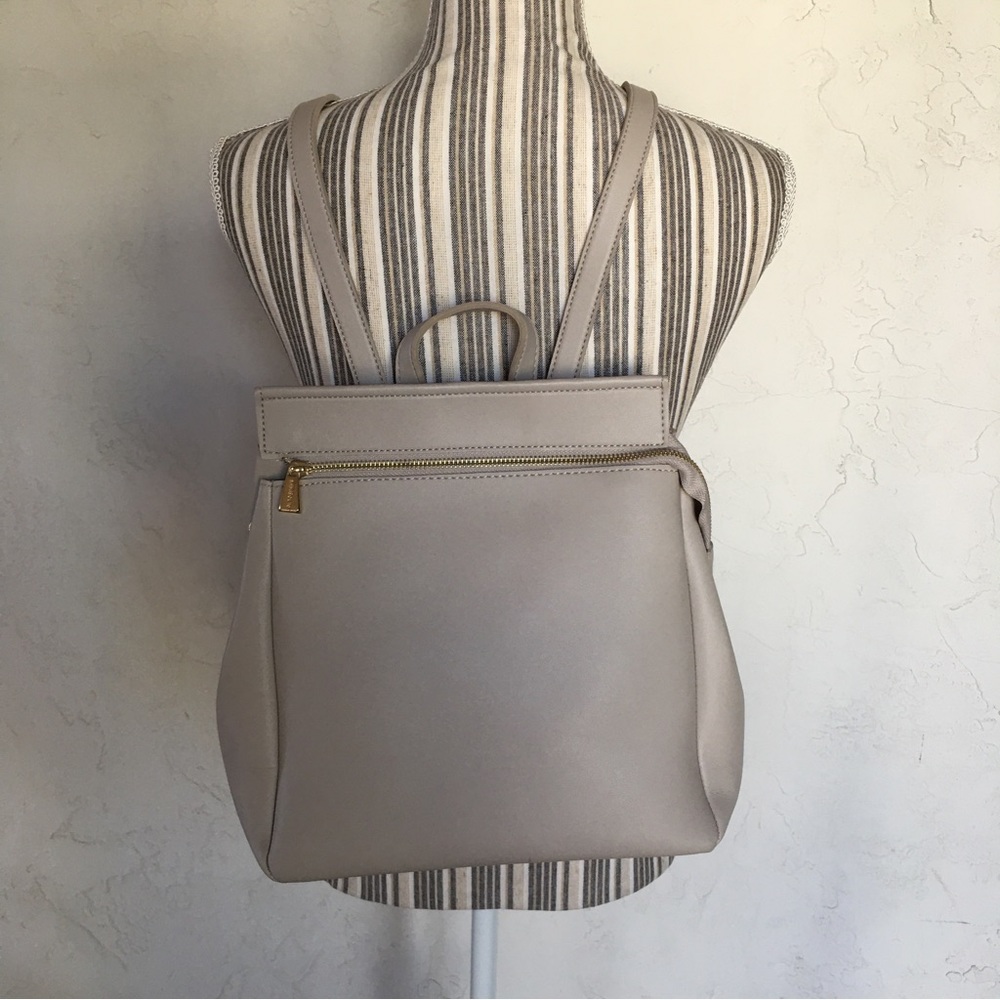MINISO BEIGE/GOLD ACCENTS BACKPACK, RESIZABLE AND VERSATILE